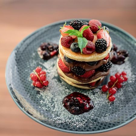 Address Istanbul 호텔 외부 사진 A stack of pancakes with fruit